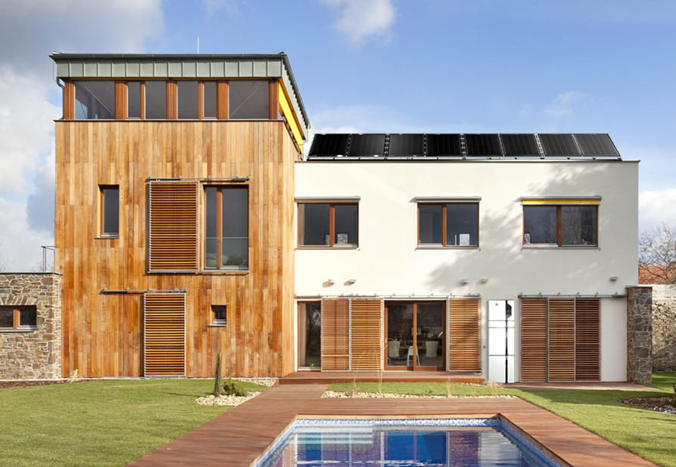 Rendering of interior with blue concrete wall and wooden floor.